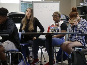 In this photo taken Tuesday, May 21, 2019, 11th grade students learn about the D-Day invasion at Normandy during an advanced placement history class at Crossroads FLEX school in Cary, N.C. Its 75th anniversary brings extra classroom attention to D-Day, which has waned as a topic that's emphasized in schools across the world. In a North Carolina classroom, students learn about spies, the deadly military practice before D-Day and a general who kept his plans "on the down low."