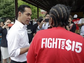 Presidential candidate and former U.S. Department of Housing and Urban Development Julian Castro speaks with a supporter prior to rallying with McDonald's employees and other activists demanding fairer pay, better working conditions, and the right to unionize in Durham, N.C., Thursday, May 23, 2019.