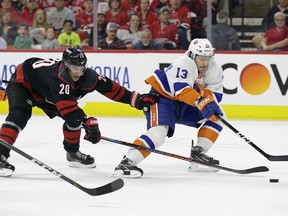 Carolina Hurricanes' Sebastian Aho (20), of Finland, chases New York Islanders' Mathew Barzal (13) during the first period of Game 4 of an NHL hockey second-round playoff series in Raleigh, N.C., Friday, May 3, 2019.