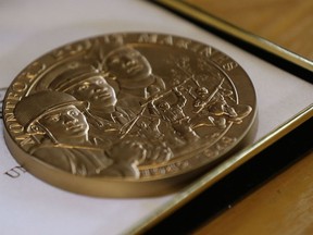 In this photo taken April 11, 2019, in Durham, N.C. a Congressional Gold Medal belonging to former Montford Point Marine William Burton, presented for his service as a U.S. Marine in the South Pacific during World War II, is displayed during an interview in his home.