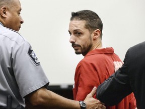 FILE - In this Aug. 8, 2016 file photo, Chad Copley is led out of a courtroom at the Wake County Judicial Center in Raleigh, N.C.  North Carolina's second-highest court says Copley, who reported "hoodlums" in his neighborhood before he shot and killed an unarmed black man should get a new trial. In a 2-1 ruling Tuesday, May 7, 2019, the state Court of Appeals said 42-year-old Chad Copley of Raleigh deserves another trial because the prosecutor gratuitously injected race in his closing argument. Copley was sentenced to life in prison in 2018 for killing 20-year-old Kouren Thomas outside Copley's home in August 2016.