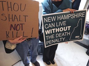 Protestors gather outside the Senate Chamber prior to a vote on the death penalty at the State House in Concord, N.H., Thursday, May 30, 2019. New Hampshire, which hasn't executed anyone in 80 years and has only one inmate on death row, on Thursday became the latest state to abolish the death penalty when the state Senate voted to override the governor's veto.