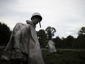 FILE - In this Sept. 19, 2016, file photo shows sculptures by Frank Gaylord at the Korean War Veterans Memorial in Washington. The U.S. military says it has identified the remains of three more Americans killed during the Korean War, even as efforts to recover additional remains have stalled amid souring relations with North Korea.
