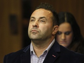 FILE - In this Oct. 15, 2014 file photo, Giuseppe "Joe" Giudice, from the television show "Real Housewives of New Jersey", stands during a hearing in the Passaic County Courthouse in Paterson, N.J.  A federal court ruled this week that Giudice can stay in the U.S. as his appeal progresses.  Giudice and his wife, Teresa, pleaded guilty in 2014 to financial fraud. Teresa Giudice served her sentence first and was released in December 2015. In an order published Wednesday, May 22, 2019,  the 3rd U.S. Circuit Court of Appeals in Philadelphia delayed Giudice's deportation.