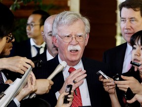 U.S. National Security Adviser John Bolton is surrounded by reporters at the prime minister's official residence in Tokyo, Japan.