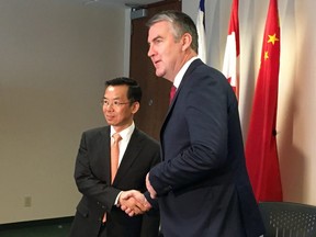 China's ambassador to Canada Lu Shaye shakes hands with Nova Scotia Premier Stephen McNeil in Halifax on Wednesday, May 29, 2019.