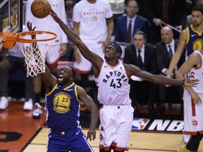 Toronto Raptors forward Pascal Siakam (43) rejects Golden State Warriors forward Draymond Green (23) during second half NBA championship basketball finals action in Toronto on Thursday, May 30, 2019.