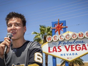 FILE - In this May 2, 2019, file photo, "Jeopardy!" sensation James Holzhauer speaks after being presented with a key to the Las Vegas Strip in front of the Welcome to Fabulous Las Vegas sign in Las Vegas. Holzhauer's "Jeopardy" winning streak is still going and he may be track to surpass Ken Jennings' record earnings in the next month.