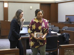 Cadesha Bishop, 25, right, accused of shoving a 74-year-old man off a bus, leaves the courtroom with her attorney Baylie Hellman after her preliminary hearing at the Regional Justice Center on Thursday, May 23, 2019, in Las Vegas. Bishop was arrested May 6 on a murder charge in the death of Serge Fournier, who was pronounced dead on April 23 from complications of blunt force injuries he suffered a month earlier. She is accused of shoving a 74-year-old man off a public bus after witnesses say he asked her to be nice to other passengers.