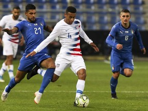 FILE - In this Tuesday, Nov. 20, 2018 file photo, Italy's Emerson (21), United States' Tyler Adams (4) and Italy's Marco Verratti (6) fight for the ball during the international friendly soccer match at the Cristal Arena in Genk, Belgium. American midfielder Tyler Adams has recovered from an adductor injury that has sidelined him for more than a month and could play in RB Leipzig's Bundesliga finale this weekend. The 20-year-old is available for Saturday's match at Werder Bremen, Leipzig said Thursday, May 16, 2019.