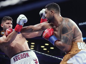 FILE - In this Dec. 22, 2018, file photo, Dominic Breazeale, right, punches Carlos Negron during the first round of a heavyweight boxing match in New York. Breazeale stopped Negron in the ninth round. Breazeale faces Deontay Wilder on Saturday, May 18.