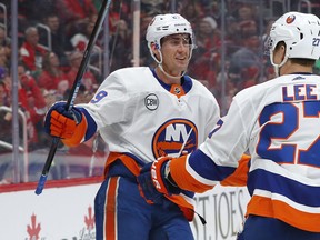 FILE - In this March 16, 2019, file photo, New York Islanders' Brock Nelson, left, congratulates left wing Anders Lee on his goal in the first period of an NHL hockey game against the Detroit Red Wings, in Detroit. The Islanders have agreed to terms with center Brock Nelson on a six-year contract through the 2024-25 season. General manager Lou Lamoriello announced the contract Thursday, May 23, 2019.