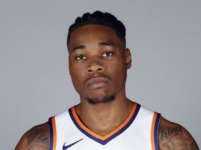 FILE - In this Sept. 24, 2018, file photo, Phoenix Suns' Richaun Holmes poses for a photograph during media day at the NBA basketball team's practice facility in Phoenix. Phoenix Suns big man Richaun Holmes was arrested for misdemeanor possession of cannabis after a Miami-area traffic stop. Twenty-five-year-old Holmes was arrested Tuesday night, May 22, 2019, along with former Brooklyn Nets forward James Webb III after authorities say the found a recently used marijuana joint inside their vehicle.