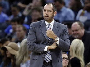 FILE - In this Oct. 24, 2017, file photo, Orlando Magic coach Frank Vogel watches his team play the Brooklyn Nets during the first half of an NBA basketball game in Orlando, Fla.  A person familiar with the search says the Los Angeles Lakers have hired Vogel as coach. The person spoke to The Associated Press on condition of anonymity Saturday, May 11, because the hiring has not been announced. Vogel flew to Los Angeles on Thursday. The 45-year old Vogel did not coach last season following two years with the Magic.