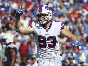 FILE - In this Sept. 16, 2018, file photo, Buffalo Bills defensive end Trent Murphy (93) celebrates a play against the Los Angeles Chargers during the second half of an NFL game in Orchard Park, N.Y. Murphy acknowledges he was fooling himself for scoffing at the projections of how long it would take to recuperate from a severe injury to his left knee.