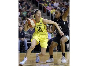 FILE - In this Aug. 17, 2018, file photo, Seattle Storm's Sue Bird (10) tries to get past New York Liberty's Brittany Boyd during the first of a WNBA basketball game, in Seattle. Sue Bird needs arthroscopic surgery on her left knee and will be out indefinitely, another big blow for the defending WNBA champs. The Storm announced Tuesday, May 21, 2019, that the 11-time All-Star has a loose body in her left knee. Bird will undergo surgery in Connecticut in the near future.