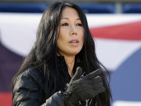 FILE - In this Dec. 23, 2018, file photo, Buffalo Bills co-owner Kim Pegula stands on the field as the team warms up before an NFL football game against the New England Patriots, in Foxborough, Mass. A person with direct knowledge of the decision tells The Associated Press that Kim Pegula, also owner of the Buffalo Beauts, has given up control of the National Women's Hockey League franchise. The person spoke to The AP on Wednesday, May 8, 2019, on the condition of anonymity because the decision won't be announced until later in the day. The person said Beauts owner Kim Pegula informed NWHL Commissioner Dani Rylan of her decision during a conference call Tuesday.
