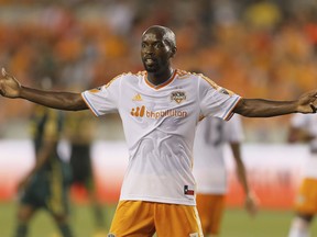 FILE - In this Saturday, May 16, 2015 file photo, Houston Dynamo midfielder DaMarcus Beasley gestures to the linesman for a call in the first half of an MLS soccer game against the Portland Timbers in Houston. DaMarcus Beasley says he will retire at the end of the Houston Dynamo season after 20 years in professional soccer. Beasley, a midfielder and left back, is the only American who has played in four World Cups and the only American to appear in a European Champions League semifinal. He turns 37 on May 24, 2019.