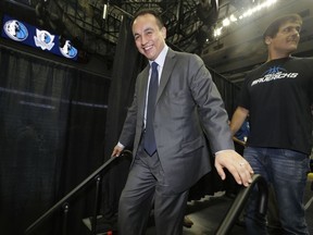 FILE - In this Aug. 15, 2013, file photo, Dallas Mavericks general manager Gersson Rosas walks off the stage after an NBA basketball news conference in Dallas. A person with knowledge of the process tells The Associated Press that the Minnesota Timberwolves have decided to hire Rosas as president of basketball operations. The person spoke on condition of anonymity Wednesday, May 1, because the team had yet to announce the hire of Rosas, who has been a finalist for the top job with several other NBA teams. He had a three-month stint as general manager of the Mavericks in 2013, before resigning and returning to the Rockets,