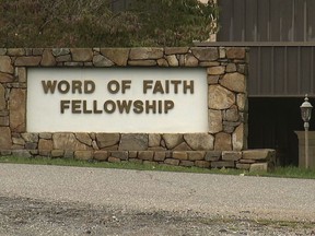 FILE - This 2016 image from video shows the entrance to the Word of Faith Fellowship church in Spindale, N.C. On Friday, May 10, 2019, Diane McKinny, a member of the secretive North Carolina church, is expected to enter a plea on a federal fraud charge as part of an investigation into an unemployment scheme benefiting businesses with ties to the congregation, according to court documents.