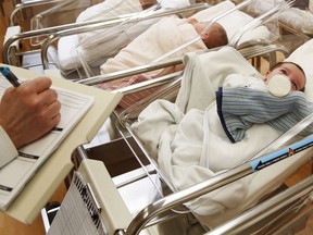 FILE - This Feb. 16, 2017 file photo shows newborn babies in the nursery of a postpartum recovery center in upstate New York. According to a government report released Wednesday, May 15, 2019, U.S. birth rates reached record lows for women in their teens and 20s, leading to the fewest babies in 32 years.