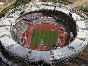 FILE - In this Aug. 3, 2012, file photo, Olympic Stadium is viewed during the Summer Olympics at Olympic Park in London. The traditional rivalry New York Yankees and the Boston Red Sox will take a radical twist when they meet in London next month: They will play on artificial turf for the first time in more than 2,200 games over a century. Major League Baseball has access to Olympic Stadium for 21 days before the games on June 29 and 30, the sport's first regular-season contests in Europe, and just five days after to clear out.