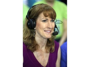 FILE - In this March 5, 2017, file photo, Debbie Antonelli, a women's college basketball analyst for ESPN, listens before a women's NCAA college basketball game between Duke and Notre Dame in Conway, S.C. Antonelli wanted to do something to help raise money and awareness for South Carolina Special Olympics. So about a year ago she came up with the concept of '24 Hours of Nothing But Net". She vowed to make 2,400 free throws for 24 straight hours. She did just that over the weekend, making 2,400 of 2,553 free throws, hitting at 94% accuracy, at the Mount Pleasant Town Hall gym.