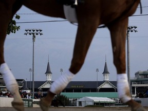 A horse is ridden to the track for a workout at Churchill Downs, Wednesday, May 1, 2019, in Louisville, Ky.