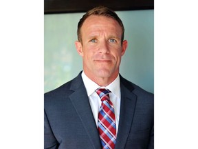 FILE - This 2018 file photo provided by Andrea Gallagher shows her husband, Navy SEAL Edward Gallagher, who has been charged with murder in the 2017 death of an Iraqi war prisoner. Lawyers on Gallagher's defense team told The Associated Press that emails they and a reporter received from military prosecutors in the case contained tracking software.