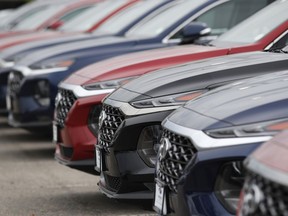 FILE - In this May 19, 2019, file photo, a line of unsold 2019 Tucson sports-utility vehicles sits at a Hyundai dealership in Littleton, Colo. On Friday, May 31, the Commerce Department issues its April report on consumer spending, which accounts for roughly 70 percent of U.S. economic activity.