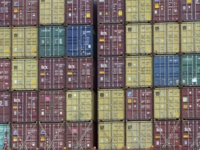 FILE - In this July, 5, 2018 photo, a bay of 40-foot shipping container fill the stern of a container ship at the Port of Savannah in Savannah, Ga. President Donald Trump turned up the pressure on China Sunday, May 5, 2019, threatening to hike tariffs on $200 billion worth of Chinese goods.