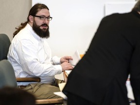 FILE - In this May 15, 2019 file photo, Steven Bourgoin, left, greets his defense attorney Robert Katims during his murder trial in Vermont Superior Court in Burlington, Vt. Closing arguments are expected Monday, May 20  in the trial of Bourgoin, a Vermont man facing murder charges in the deaths of five teenagers after he drove the wrong way on Interstate 89.