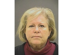 FILE - This undated file photo provided by the Baltimore Police Department shows former Episcopal Bishop Heather Cook. Cook, who fatally struck a bicyclist while drunk and texting behind the wheel more than four years ago, has been released from a Maryland prison. She was the second-highest-ranking Episcopal leader in the mid-Atlantic state when the fatal Baltimore crash occurred two days after Christmas 2014. Her lawyer says she was released Tuesday, May 14, 2019, from the Maryland Correctional Institute for Women. (Baltimore Police Department via AP, File)