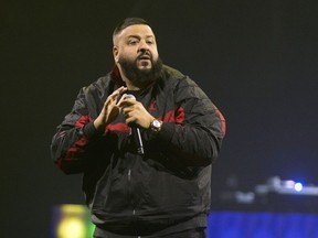 FILE - In this March 23, 2018 file photo, DJ Khaled performs as the opening act for Demi Lovato during her "Tell Me You Love Me World Tour" in Philadelphia. Khaled is releasing a single with Nipsey Hussle that was filmed days before Hussle was shot to death in Los Angeles. Khaled announced on Twitter on Wednesday, May 15, 2019, that all proceeds from "Higher" will be donated to Hussle's children, 10-year-old Emani and 2-year-old Kross.