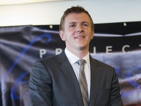 FILE - In this Sept. 1, 2015, file photo, James O'Keefe, President of Project Veritas Action, waits to be introduced during a news conference at the National Press Club in Washington. A trial over a lawsuit against O'Keefe is under way in North Carolina. At issue is how a woman who was struck in the face outside a 2016 Donald Trump campaign rally was portrayed in a video. Jurors in Asheville were sequestered overnight to hear testimony Tuesday, May 21, 2019, in Shirley Teter's lawsuit. Police said the disabled woman was assaulted and knocked to the ground.