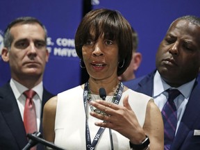 FILE - In this June 8, 2018 file photo, Baltimore Mayor Catherine Pugh addresses a gathering during the annual meeting of the U.S. Conference of Mayors in Boston. The lawyer for Baltimore's mayor is making an announcement Thursday, May 2, 2019, amid growing pressure for the city's top leader to resign over a scandal involving her self-published children's books. Pugh has been in self-imposed seclusion for a month with what attorney Steven Silverman has said is "deteriorating health after a bout of pneumonia.