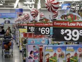 FILE - This Oct. 26, 2016, file photo, shows prices in the toy section at Walmart in Teterboro, N.J.  An escalating trade war with China could mean higher prices on a broad array of products from toys to clothing. But some retailers will feel more pain than others, further deepening the divide between the winners and the losers that was evident in the latest earnings reports. Analysts say big box giants like Walmart and Target, which have had strong performances, are best positioned to absorb the higher costs because of their clout with suppliers.