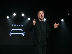 FILE- In this March 14, 2019, file photo Tesla CEO Elon Musk speaks before unveiling the Model Y at Tesla's design studio in Hawthorne, Calif. Shares of electric vehicle maker Tesla Inc. fell at the opening bell Thursday, May 23 but recovered into positive territory after an analyst predicted falling demand but Musk told employees that orders are up. The gyrations within an hour of when the markets opened were indicators of a volatile day for the shares, which have shed about 40 percent of their value this year and are trading at the lowest levels since late 2016.