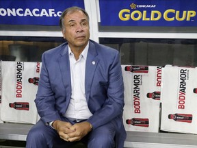 FILE - In this July 22, 2017, file photo, United States head coach Bruce Arena sits on the bench prior to a CONCACAF Gold Cup semifinal soccer match against Costa Rica, in Arlington, Texas. The New England Revolution have hired five-time MLS Cup winner and former U.S. national coach Bruce Arena as its coach and sports director.