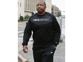 FILE - In this Sept. 27, 2017, file photo, Lamont Evans, an assistant basketball coach at Oklahoma State University, leaves the federal courthouse following a court appearance in Oklahoma City. Christian Dawkins, a  former recruiter for a professional sports agent, denied on Wednesday, May 1, 2019, allegations that he paid a $2,500 bribe to then-University of South Carolina assistant Lamont Evans. He told a federal jury that the money was meant to pay expenses for the family of South Carolina basketball player P.J. Dozier, a top NBA prospect at the time. Evans has pleaded guilty to bribery conspiracy charges and awaits sentencing.