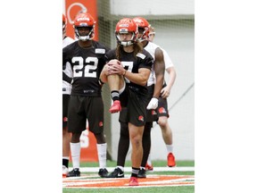 In this Friday, May 3, 2019 photo, Cleveland Browns punter Jamie Gillan (7) loosens up during  NFL football rookie minicamp in Berea, Ohio. While preparing for the draft, Gillan kicked so hard he ruined three regulation NFL footballs, enhancing the story behind "The Scottish Hammer" who started in Scotland's highlands, stopped in Arkansas and is now in Cleveland trying to win a punting job with the Browns.