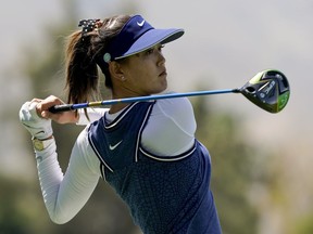 FILE - In this April 5, 2019, file photo, Michelle Wie watches her tee shot on the 118th hole during the second round of the LPGA Tour ANA Inspiration golf tournament at Mission Hills Country Club in Rancho Mirage, Calif. Wie has withdrawn from next week's U.S. Women's Open champion to continue her recovery from a hand injury.