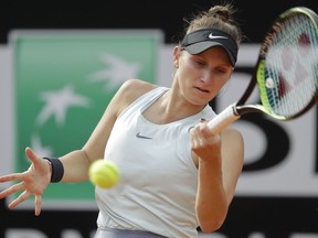 FILE - In this May 17, 2019, file photo, Marketa Vondrousova, of the Czech Republic, returns the ball to Johanna Konta of Britain during a quarterfinal match at the Italian Open tennis tournament, in Rome. Vondrousova, 19, is a player to watch at the 2019 French Open, which begins Sunday. The lefty is 21-5 since the Australian Open.