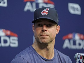 FILE - In this Oct. 4, 2018, file photo, Cleveland Indians starting pitcher Corey Kluber listens to a question during a baseball news conference in Houston. The Indians ace had the hard cast protecting his broken right arm removed and the two-time Cy Young winner is healing as hoped. Kluber underwent imaging texts Thursday, May 23, 2019, which showed that his ulna is mending.