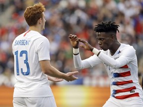 FILE - In this May 28, 2018, file photo, United States' Josh Sargent, left, and Tim Weah celebrate during an international friendly soccer match against Bolivia in Chester, Pa. Weah was included on the U.S. roster for the FIFA Under-20 World Cup on Friday, May 10, 2019, but Sargent was not, making it likely he will be with the senior national team at the CONCACAF Gold Cup this summer.