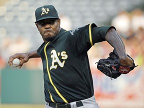 FILE - In this Aug. 11, 2018, file photo, Oakland Athletics starting pitcher Edwin Jackson throws during the first inning of a baseball game against the Los Angeles Angels in Anaheim, Calif. Jackson was acquired by Toronto from Oakland for cash on Saturday, May 11, 2019, and would set a record by pitching for 14 major league teams when he makes his Blue Jays debut.