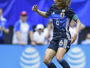 FILE - In this June 5, 2016, file photo, Japan defender Rumi Utsugi dribbles upfield during the first half of an international friendly soccer match against the United States in Cleveland, Ohio.