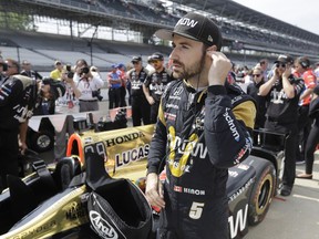 FILE - In this May 20, 2017, file photo, James Hinchcliffe, of Canada, waits for the start of qualifications for the Indianapolis 500 IndyCar auto race at Indianapolis Motor Speedway in Indianapolis. If Hinchcliffe has learned anything about Indianapolis Motor Speedway over the last eight years, it's how exhilarating and cruel this track can be to drivers.