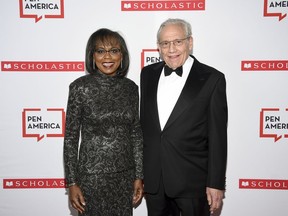 PEN courage award recipient Anita Hill, left, and PEN literary service award recipient Bob Woodward pose together at the 2019 PEN America Literary Gala at the American Museum of Natural History on Tuesday, May 21, 2019, in New York.