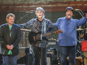 FILE - This April 6, 2017 file photo shows Jeff Cook, from left, Randy Owen, and Teddy Gentry from the band Alabama performing at the Bridgestone Arena  in Nashville, Tenn. Alabama is extending their 50th anniversary tour this year with 29 more shows, including a show with the Beach Boys and additional dates in Canada.
